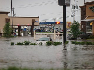 A pair of 70-year-old reservoir dams that protect downtown Houston and a levee in a suburban subdivision began overflowing Tuesday, adding to the rising floodwaters from Harvey that have crippled the area after five consecutive days of rain that set a new U.S. record for rainfall for a tropical system. Photo courtesy Flickr/Todd Dwyer