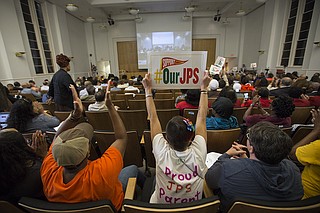 Parents and advocates who oppose the state takeover of Jackson Public Schools watched the State Board of Education meeting from the second-floor auditorium on Thursday; JPS supporters cheered when Interim Superintendent Freddrick Murray asked the board to not declare an “emergency.”