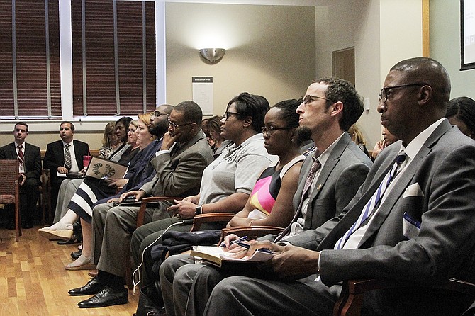 Jackson Public Schools Board of Trustee members and supporters look on as the Mississippi Board of Education Chairwoman Paula Vanderford announces the decision to declare JPS in an “extreme emergency” situation on Sept. 14.
