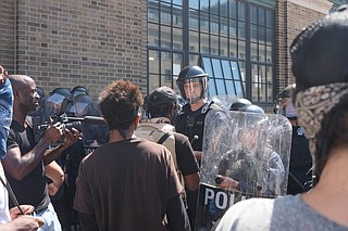 Scholars and activists say the latest demonstrations in Missouri, like the Ferguson protests, aren't just about another police shooting. They reflect unaddressed racial disparities going back generations. Photo courtesy Flickr/Paul Sableman