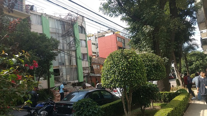 At least 38 buildings, including apartments and office buildings, collapsed during the earthquake. Photo courtesy Flickr/b de baca