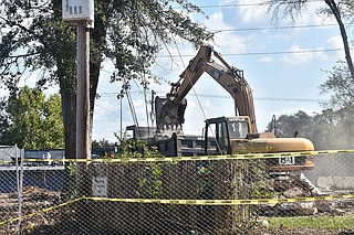 Construction workers clean the debris and remains from the “Fondren House” on North State Street that developers demolished on Sept. 21.