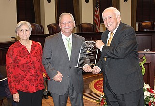 Former Mississippi Supreme Court Justice Jess Dickinson (center), with his wife Janet (left) and Justice Jim Kitchens (right), became the commissioner of the Mississippi Department of Child Protection Services last week and faces a slew of backlogged cases. Photo courtesy Administrative Office of the Courts