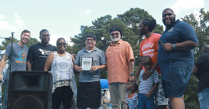 Local restaurants and chefs submitted dishes for the event's West Jackson Food Competition, and a panel of judges and attendees voted separately on first-place and second-place winners. (left to right) Alan Grove, Nick Wallace, Lee Harper, Clemente Ochoa, Pastor Calvin Waddy, Micah Briggs and Pastor John P. Perkins Photo courtesy Alan Grove