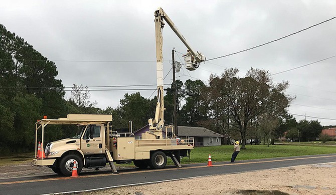 Nate knocked out power to more than 100,000 residents in Mississippi, Alabama, Louisiana and Florida, but crews worked on repairs and it appeared most of the outages had been fixed by Monday morning. Photo courtesy Singing River Electric Power Association