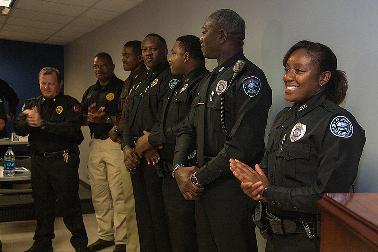 Officer Cossandra Felton (right) is Jackson’s first woman SWAT officer. Also pictured, from left: JPD SWAT Commander Steve McDonald, Hinds County Deputy Keith Barnett Sr., Deputy Keith Barnett Jr., JPD Corporal William Wade, and JPD Officers Cornnel Norman and George Moore Jr. Photo by Stephen Wilson