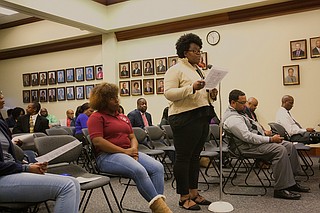 Janelle Jefferson, the PTA president at Davis IB Elementary School, read the school's resolution to the Jackson School Board of Trustees announcing the school's name change to Barack Obama Magnet IB Elementary School. Photo by Stephen Wilson