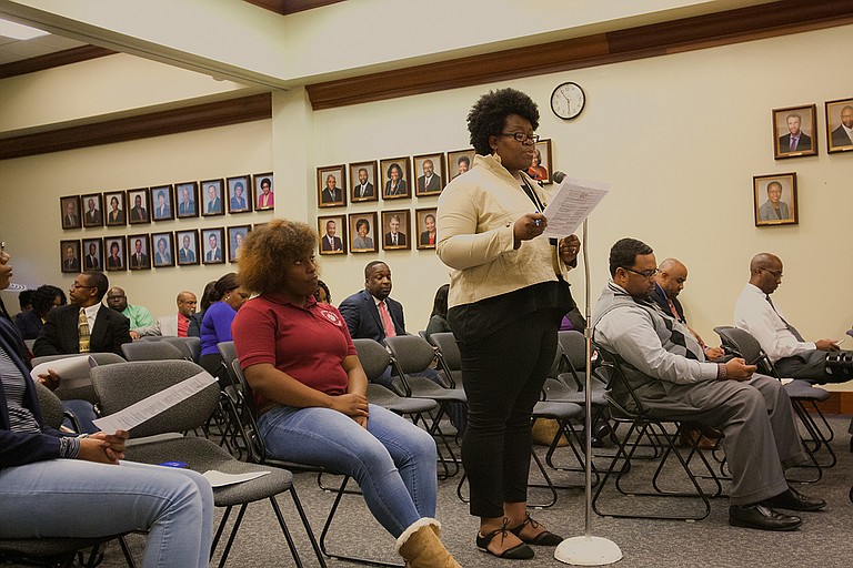 Janelle Jefferson, the PTA president at Davis IB Elementary School, read the school's resolution to the Jackson School Board of Trustees announcing the school's name change to Barack Obama Magnet IB Elementary School. Photo by Stephen Wilson