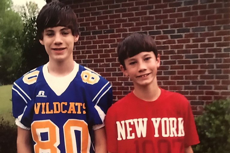 Zachary and Justin Stringer (left to right) were four years apart growing up. Their father said the boys spent most of their time outdoors either fishing or hunting. Now one is gone, and the other went to prison for killing him. Photo courtesy Roger Stringer