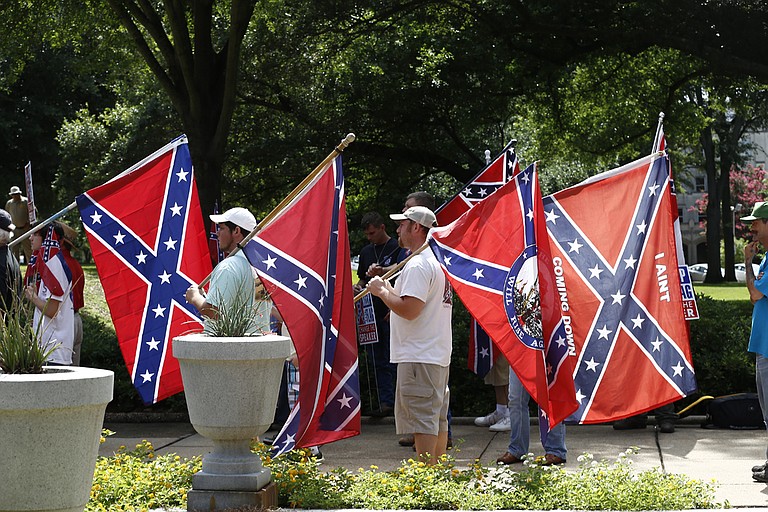 Mississippi has used the same flag since 1894 and it has the last state banner featuring the Confederate symbol—red field topped by a blue tilted cross dotted by 13 white stars. Critics say the symbol is racist. Supporters say it represents history.