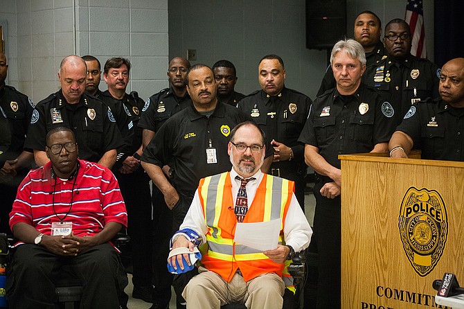 As a member of Jackson's ADA Advisory Council and Mississippi Showing Up for Racial Justice (SURJ), Scott Crawford organized for donations of 80 reflective vests to the JPD. He is pictured here at a press conference on Nov. 6. Photo by Stephen Wilson