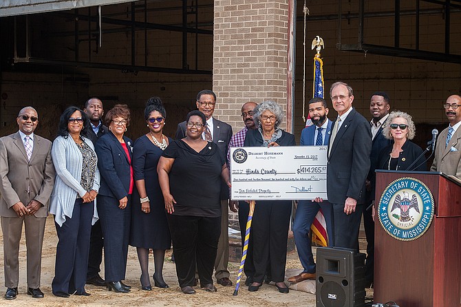 Secretary of State Delbert Hosemann's office presented Hinds County, City of Jackson and state public officials a check for tax sales on local property on Nov. 13. Photo by Stephen Wilson