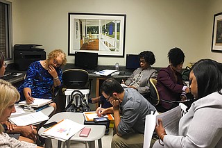 "Better Together" Commission members responsible for drafting the request-for-proposal for an independent contractor crowded into the computer lab in the Lincoln Gardens Community Center.