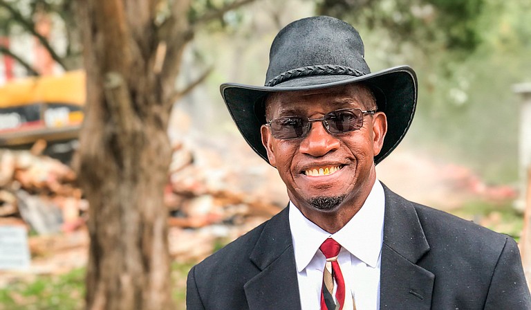 Jimmie Edwards is the pastor at Rosemont Missionary Baptist Church, which is part of a partnership that is tackling blight in west Jackson. He is pictured here at a demolition across from Lake Elementary School on Nov. 16. Photo by Ko Bragg