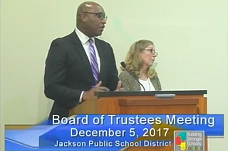 William Merritt (left) and Ann Moore (right) explain the contracts with the Bailey Group to the JPS Board of Trustees at its Dec. 5 meeting. Photo courtesy JPS TV