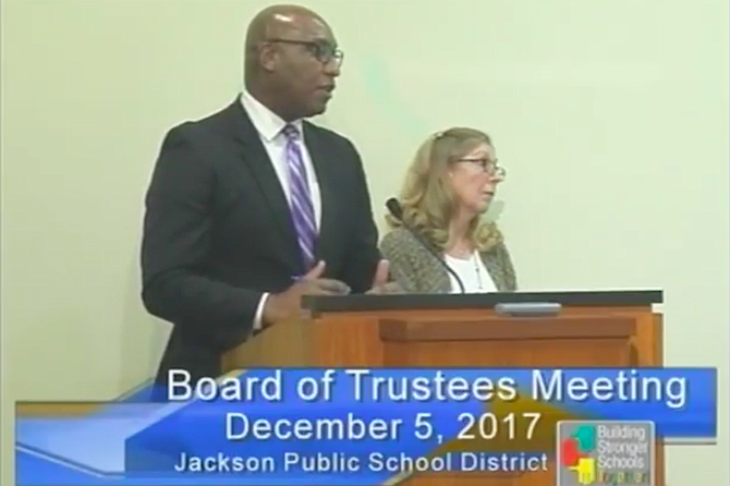 William Merritt (left) and Ann Moore (right) explain the contracts with the Bailey Group to the JPS Board of Trustees at its Dec. 5 meeting. Photo courtesy JPS TV