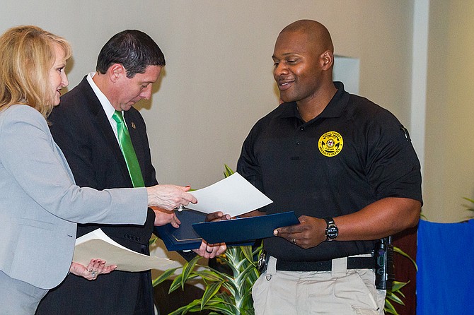 Joshua Adams, with the Hinds County Sheriff’s Department, receives his Crisis Intervention Team certificate after graduating from the CIT program on Jan. 26.