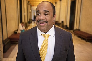 Democratic Rep. Charles Young of Meridian held his gun over his head Thursday on the House floor. He also held up his state-issued enhanced concealed carry gun permit. He said he was questioning a rule of the Mississippi House and Senate, which says only law enforcement officers may have a firearm inside the state Capitol, unless a majority of legislators grant a person permission to carry.