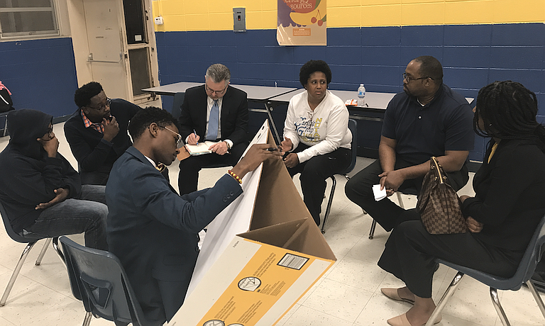 Young people in Jackson, through the Mississippi Youth Media Project and the Kappa League, are convening a series of dialogues about youth crime. Here, Jim Hill High School student Ruben Banks leads a break-out discussion about building respect between law enforcement and young people at Wingfield High School. Mississippi FBI Special Agent in Charge Christopher Freeze (in coat and tie) was his co-moderator. The next youth-crime dialogue is Thursday, March 22, from 6 to 8 p.m. at Jim Hill High School. The public is welcome.