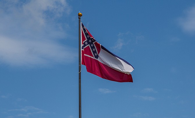 The flag is a symbol of a heritage of racism, hate, violence and capitalist exploitation at its most explicit. Photo courtesy Flickr/Diversey