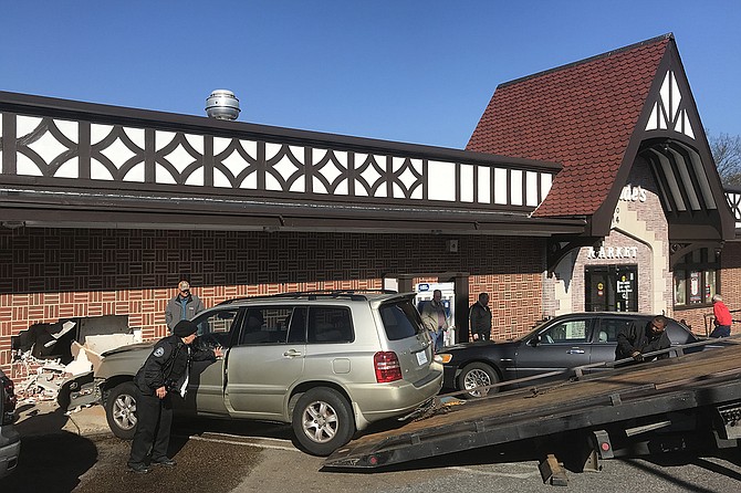 Just after 9 a.m. today, a woman drove her car into the McDade's Market on Fortification Street, hitting a worker inside. Photo by Ko Bragg