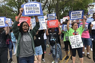 Nearly 200 people took to the streets of downtown Jackson on Saturday, March 24, 2018, for the March for Our Lives, which calls for school safety and stricter gun laws. Photo by Ko Bragg