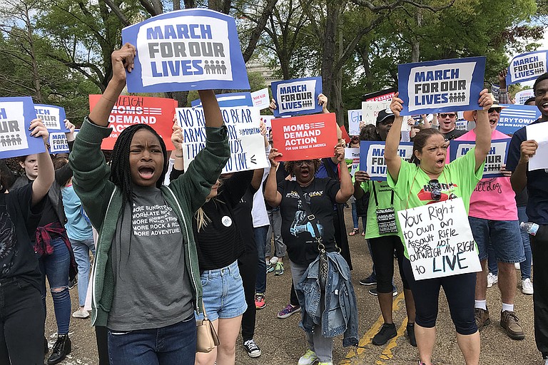 Nearly 200 people took to the streets of downtown Jackson on Saturday, March 24, 2018, for the March for Our Lives, which calls for school safety and stricter gun laws. Photo by Ko Bragg
