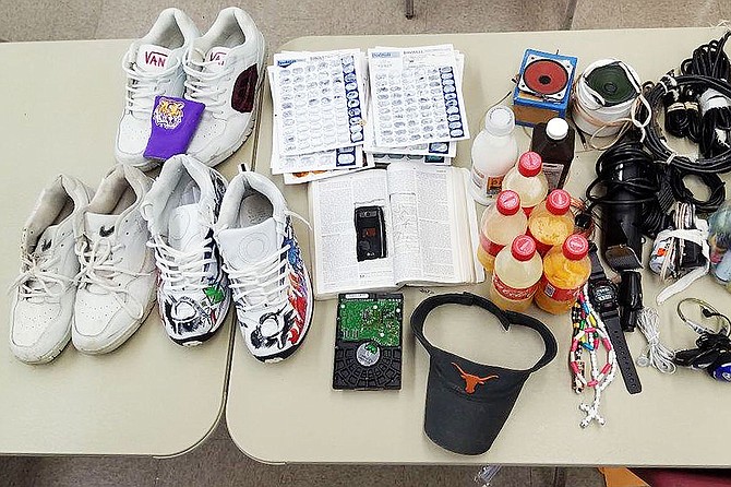 The Mississippi Department of Corrections conducted a second shakedown at South Mississippi Correctional Institution in March, finding tennis shoes, homemade alcohol and one cellphone in what appears to be a book.