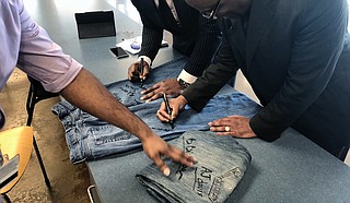 Antonio Horton, a counselor for the Latasha Norman Center and project coordinator for JSU's ONE S.A.F.E. program, encouraged students, faculty and staff to sign pairs of jeans at JSU's Denim Day event to show their support of the campaign.