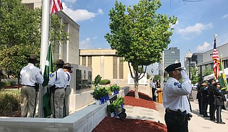 At the annual Jackson Police Department Police Memorial Service for fallen officers on May 16, 2018, City officials gave remarks before families placed yellow roses at the base of the memorial outside JPD headquarters for officers killed in the line of duty.