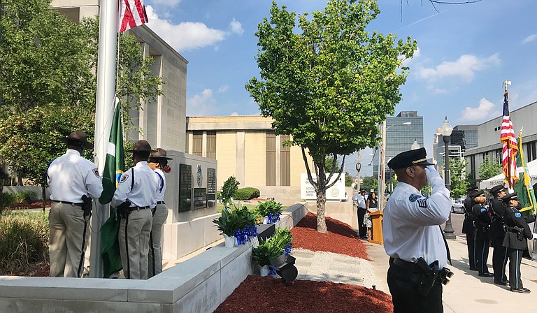 At the annual Jackson Police Department Police Memorial Service for fallen officers on May 16, 2018, City officials gave remarks before families placed yellow roses at the base of the memorial outside JPD headquarters for officers killed in the line of duty.