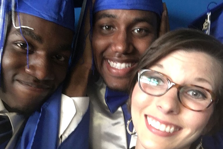 (Left to right) Caleb Kinnard, 19, took a photo with classmate Akeem Knight and teacher Olivia Coté at his Murrah High School graduation only a few weeks before suffering a fatal gunshot wound.