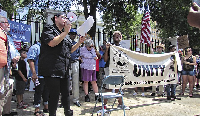 Melinda Medina, a community organizer for the Mississippi Immigrants’ Rights Alliance, speaks at a rally to end family separation on June 30.