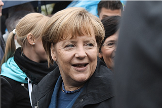 Chancellor Angela Merkel acknowledged Friday that a bitter fight over migrant policy hurt Germans' confidence in her government, but said she never thought of quitting and insisted that her administration is doing solid work.