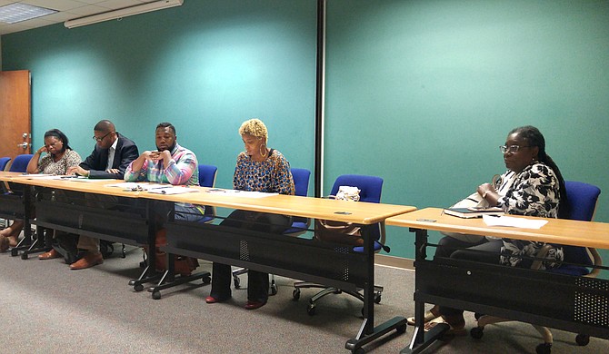 Members of the Officer ID Task Force discussed a draft of the policy. Pictured, from left to right, are Nsombi Lambright, Rickey Jones, C.J. Lawrence, Rukia Lumumba and Safiya Omari.