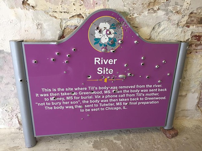 Unknown vandals shot up the Emmett Till historic sign 35 days after it was erected. Courtesy Emmett Till Interpretive Center in Sumner, Miss. 