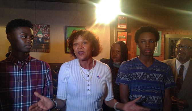 Jackson Public Schools Board President Jeanne Middleton Hairston addressed the media following the passage of the bond referendum on Aug. 7. On her left is Murrah High School sophomore Khai Thompson, and Lanier High School senior Joseph Jiles is on her right.