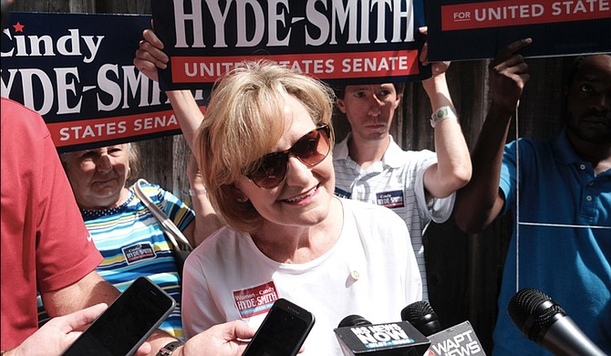 Republican U.S. Sen. Cindy Hyde-Smith answers questions from reporters at the Neshoba County Fair in Philadelphia, Miss., on Aug. 2, 2018. She became the first woman from Mississippi to serve in the U.S. Senate after Gov. Phil Bryant appointed her in April after former Sen. Thad Cochran retired due to health concerns.