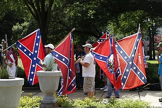 Some Mississippi residents are asking a federal court of appeals to fully consider their arguments that the state flag with the Confederate battle emblem represents white supremacy and sends a message that black people are not welcome.
