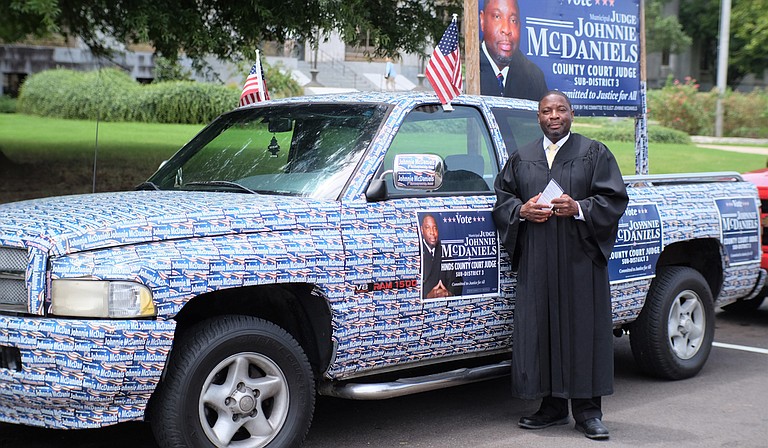 Johnnie McDaniels, executive director of Henley-Young Juvenile Justice Center, stuck 1,400 bumper stickers on his pick-up truck for the Hinds County judge race.