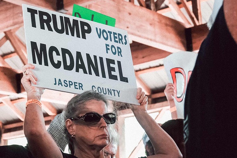Trump voters at the Neshoba County fair held signs for Chris McDaniel. Trump endorsed his opponent, Cindy Hyde-Smith, via Twitter.
