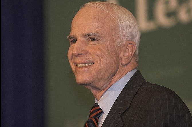 Thousands of people lined up for blocks outside the U.S. Capitol Friday to say goodbye to John McCain as officials, relatives and friends paid their tributes inside to the Vietnam hero and longtime senator lying in state under the majestic dome.