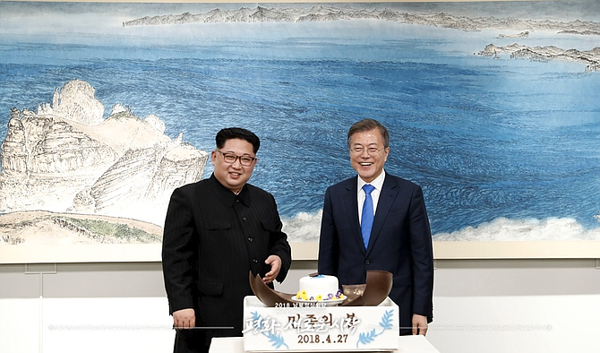 Moon Jae-in (right) faces increasing pressure from Washington to find a path forward in efforts to get Kim Jong Un (left) to completely—and unilaterally—abandon his nuclear arsenal, which is thought to be closing in on the ability to accurately target any part of the continental United States.