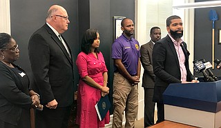 Mayor Chokwe Antar Lumumba (right) signed an executive order Monday, Sept. 24, officiating a Bill of Rights for those who pay for water and sewer in Jackson before the City begins shutting off water to nonpaying customers. Photo by Ko Bragg 