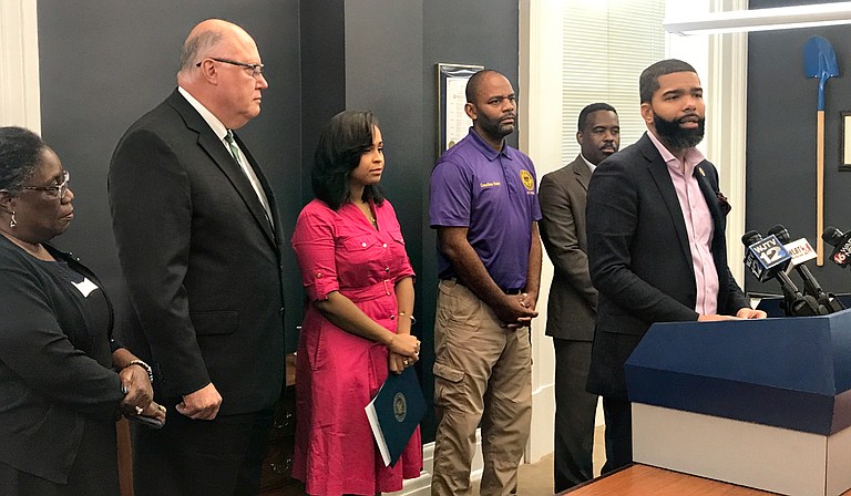 Mayor Chokwe Antar Lumumba (right) signed an executive order Monday, Sept. 24, officiating a Bill of Rights for those who pay for water and sewer in Jackson before the City begins shutting off water to nonpaying customers. Photo by Ko Bragg 