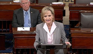 U.S. Sen. Cindy Hyde-Smith gives her maiden speech on the Senate floor in defense of Brett Kavanaugh, President Trump's Supreme Court nominee, on Sept. 26, 2018. Mississippi’s other senator, Roger Wicker, sits behind her. Screencap via Hyde-Smith's YouTube page