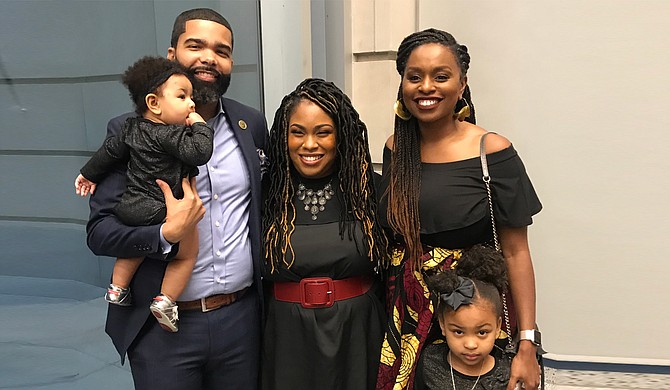 Mayor Chokwe Antar (top left) and wife Ebony Lumumba (top right) co-sponsored an event at the Mississippi Civil Rights Museum and Museum of Mississippi History on Oct. 10, 2018, to honor Angie Thomas (center) and her upcoming movie release of "The Hate U Give." The couple brought their children, Nubia (top left), and Alake (bottom right) to the event.