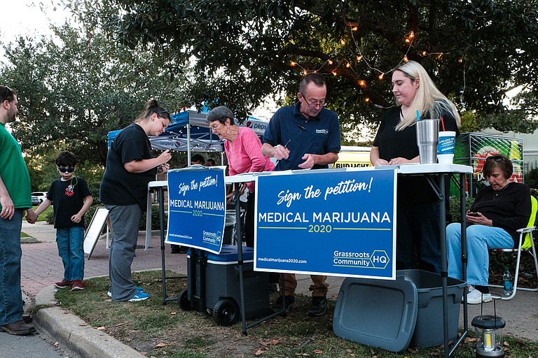 Petitioners gather signatures for the Medical Marijuana 2020 Ballot Initiative in Hattiesburg, Miss., on Oct. 12, 2018.
