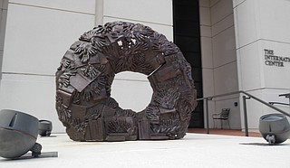 "Eudora Welty Wreath," the iron sculpture that Tordella-Williams created for the exhibition, features castings of handprints from patrons of the Eudora Welty Library in Jackson, as well as cast-off books from a book sale at the library. Photo courtesy Millsaps College