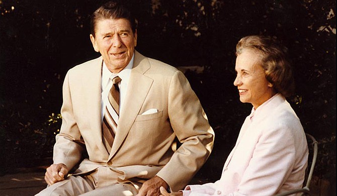 Sandra Day O'Connor (right) was a state court judge before former President Ronald Reagan (left) nominated her to the Supreme Court in 1981. Photo courtesy The Ronald Reagan Library 